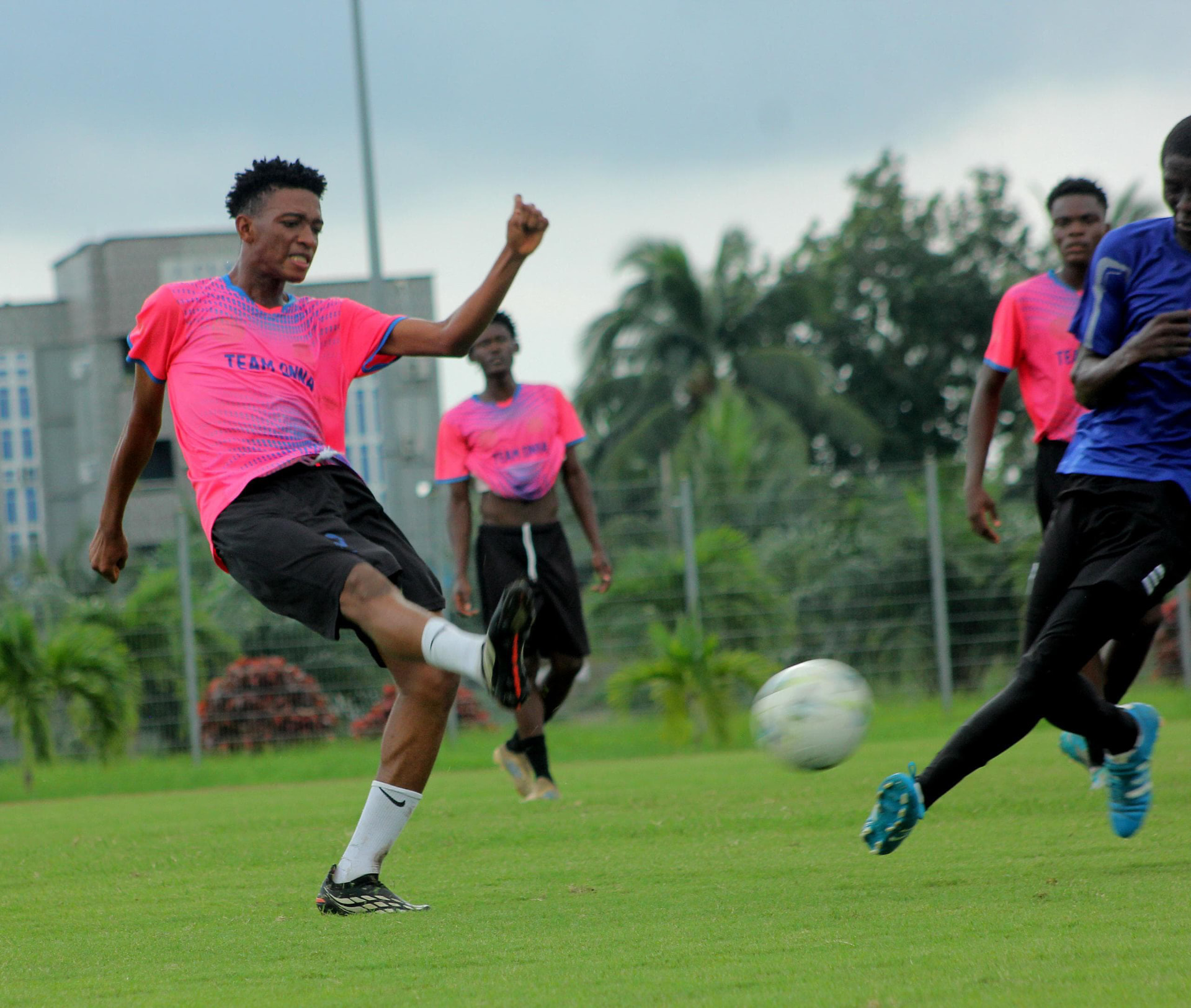 Camp Gee Football Academy player striking the ball during a training match in Uyo